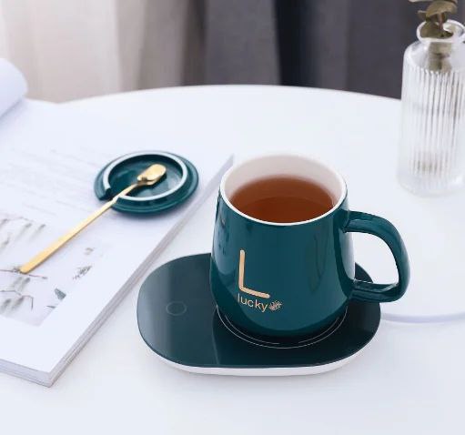 مج البورسلين الفاخر مع قاعدة تسخين كهربائية ومعلقة ذهبية – مشروبك دايمًا سخن لأخر رشفة